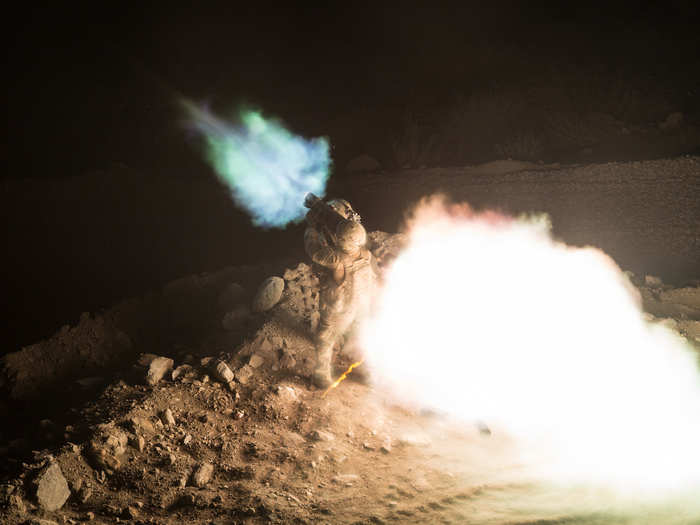 US Paratrooper Spc. Michael Tagalog, assigned to 2nd Battalion, 501st Parachute Infantry Regiment, 1st Brigade Combat Team, 82nd Airborne Division, fire a Carl Gustaf recoilless rifle from an observation post in Pekha Valley, Achin District, Nangahar Province, Afghanistan.