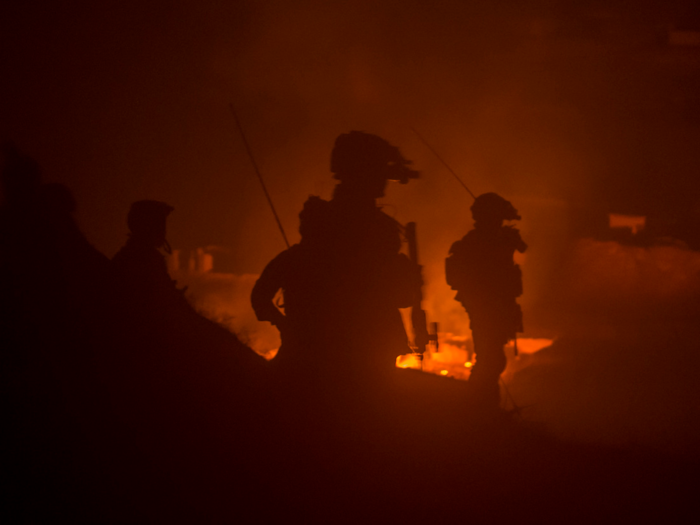 Afghan and American Special Operations soldiers destroy a Taliban weapons cache during a night operation in Ney Meydan, Sar-e Pul province, Afghanistan.