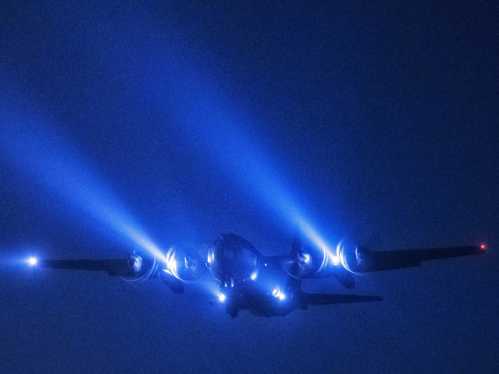 A C-130 Hercules from the 36th Airlift Squadron conducts a night flight mission over Yokota Air Base, Japan.