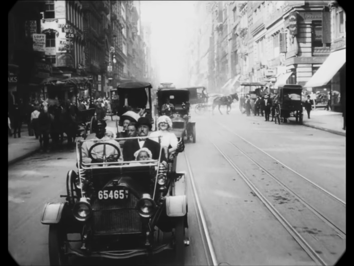 In 1911, taxis shared the road with horse-drawn carriages. A typical taxi charged $0.50 a mile back then.