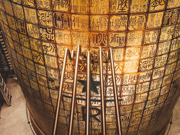 The centerpiece of the cafe is a two-story 40-ton bronze cask. The beans deposit there after roasting.