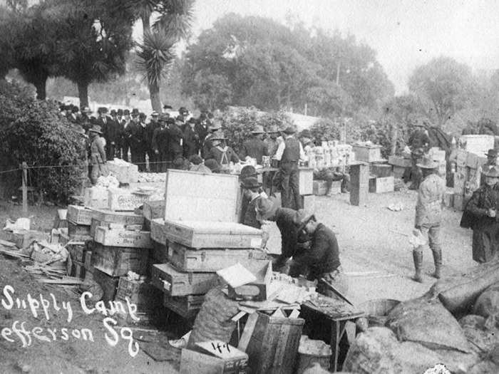 Relief stations were also set up by the US Navy and Army to distribute blankets, tents, and food. Here we see soldiers giving handouts in Jackson Square Park.