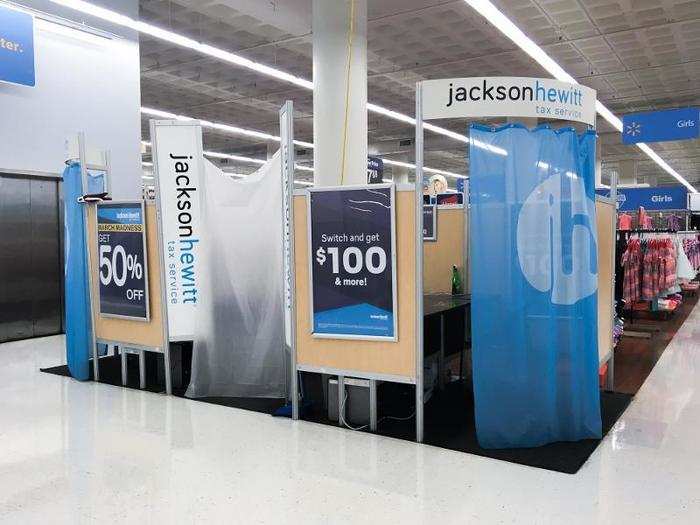 In the middle of the clothing was a Jackson Hewitt Tax Service booth. The display was using shower curtains for privacy. There didn