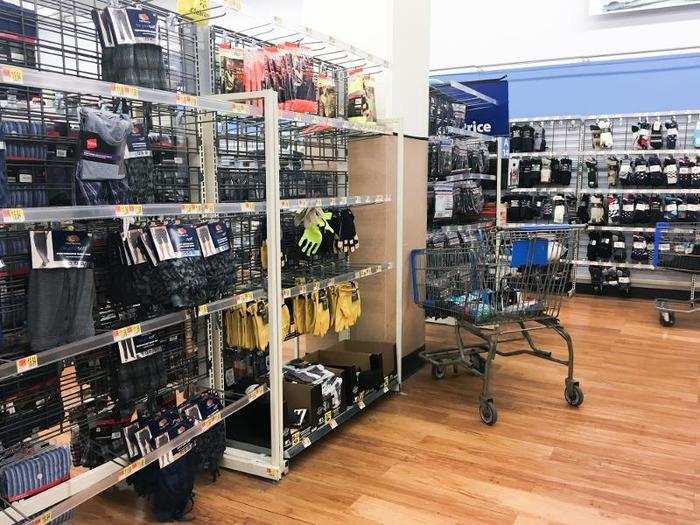 Empty shelves and abandoned shopping carts were common throughout the store.