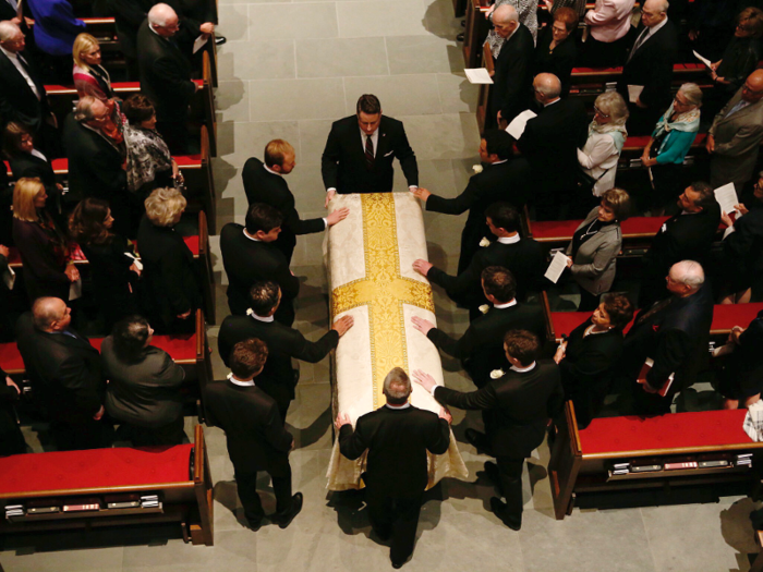 Photos shot from above the service showed a touching scene as the casket was brought into St. Martin