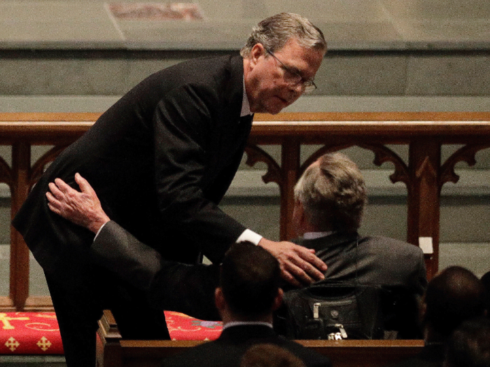 Jeb Bush could also be seen at one point comforting his father, former President George H.W. Bush ...