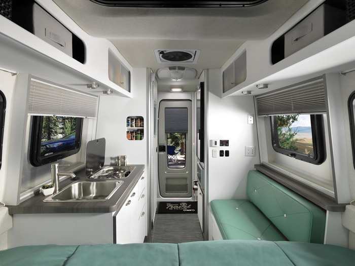 Two available floor plans provide a pair of seating setups. The first has a U-shaped dinette that converts into a bed.