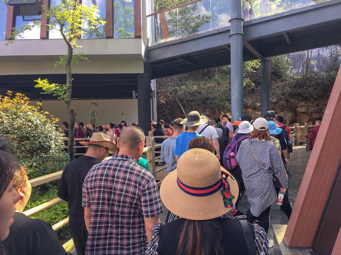 We were packed into a new line like sardines. The line passed through a outdoor stretch, and continued into another building just outside the foot of the bridge, where it snaked up and down several times. It would have been adrenaline-inducing for any claustrophobic thrill-seekers.