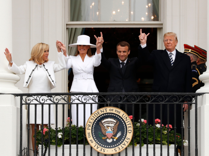 On Tuesday, the presidents and their first ladies greeted crowds at Macron