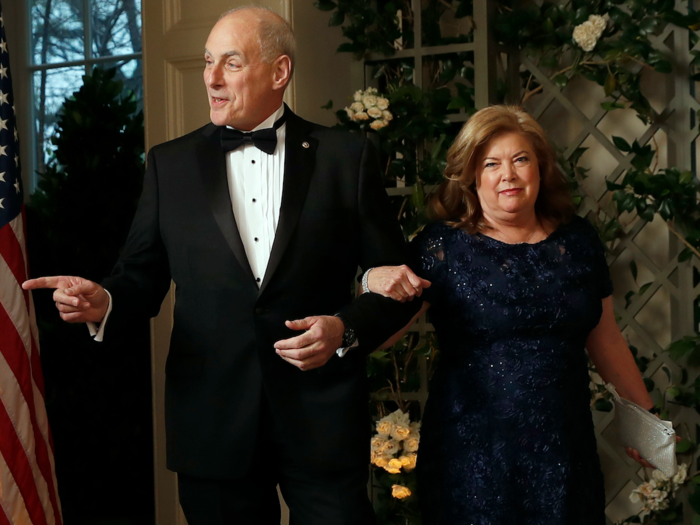 White House chief of staff John Kelly greets reporters with his wife, Karen by his side.