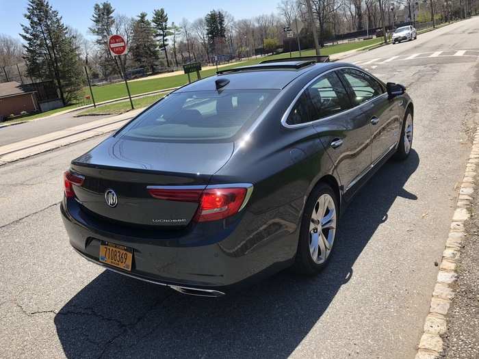 The roofline slopes rakishly to the trunk decklid, ending in a spoiler lip.