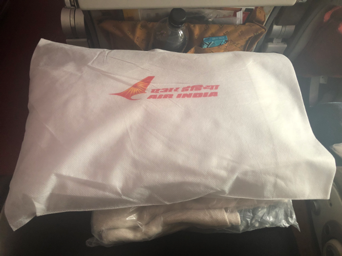 The white pillow and blanket also came emblazoned with Air India’s logo. These, along with my own personal neck pillow, were going to come in handy on this 15-hour marathon flight.