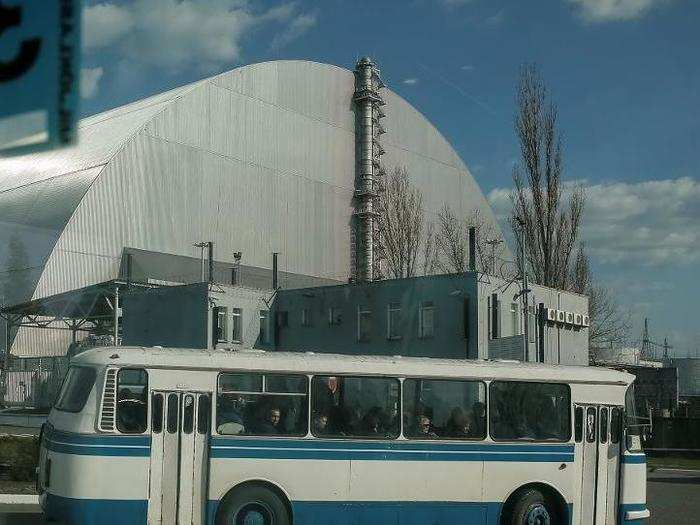 Workers arrive by bus to the NSC.