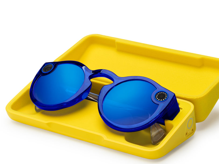 The glasses charge in their case. Snap says you can record 70 videos on a single charge.