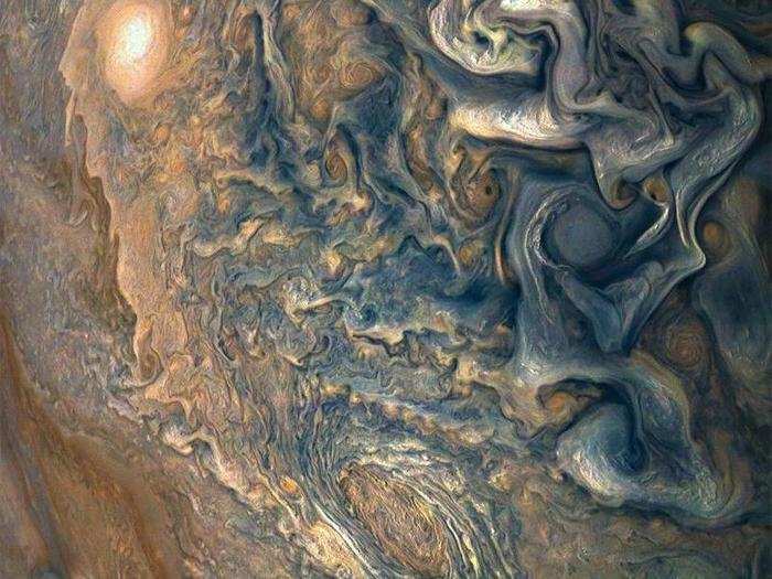 NASA described this image showing a mess of storms as a "mind-bending, color-enhanced view of the planet’s tumultuous atmosphere" in a January 2018 release.