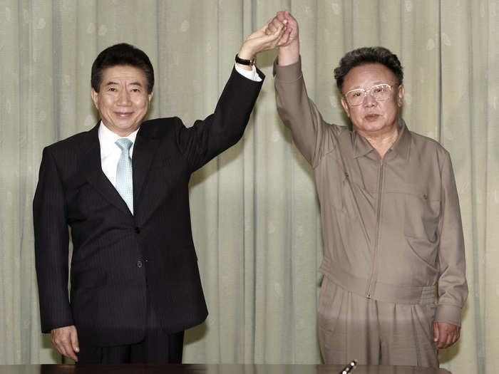 And here Kim Jong Il and Roh Moo-hyun raise their hands after exchanging a joint statement in 2007.