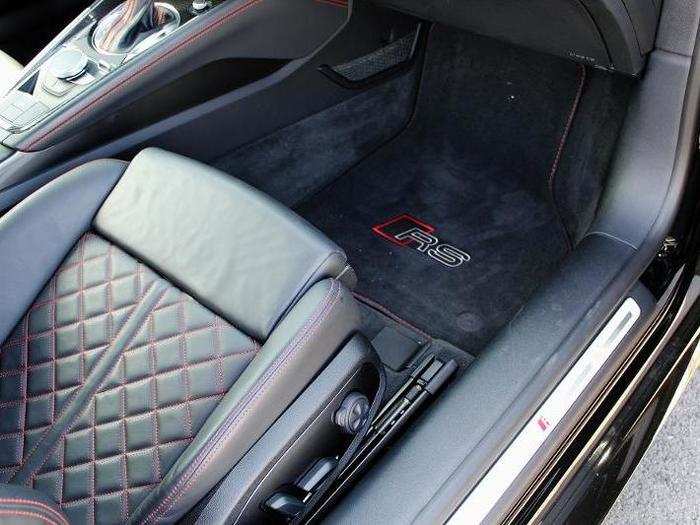 The deep side-bolsters on these quilted black leather seats help, too.