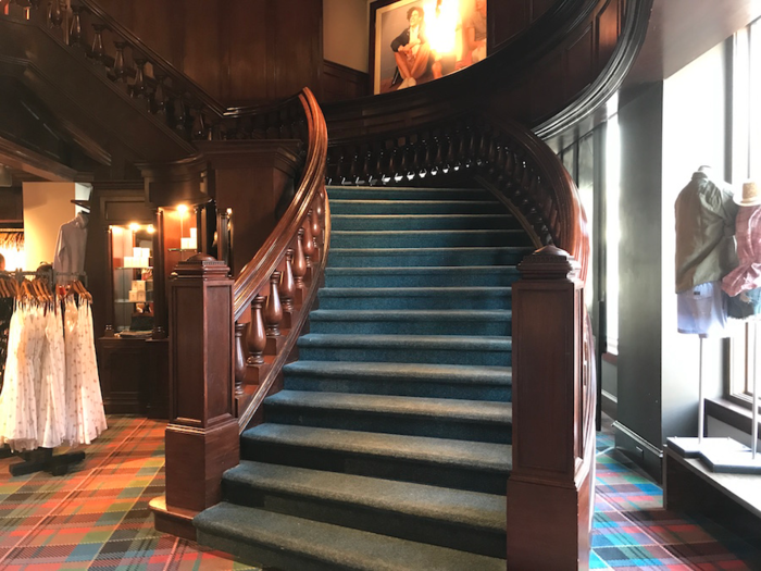 The store is brighter but the decor harks back to its former days. The imposing faux mahogany furniture and tartan carpets feel dated.