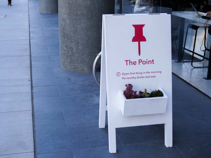 "The Point" refers to the point of the thumbtack in the logo.