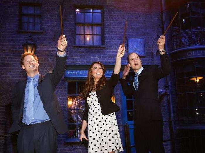 AGE 28: Harry, the Duchess of Cambridge, and Prince William play with wands on the Harry Potter set at Warner Bros. Studios in Leavesden on April 26, 2013.