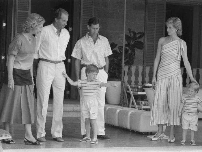 AGE 1: Harry with Queen Sofia and King Juan Carlos of Spain, Prince William, Diana, and his father, Prince Charles, at the Marivent Palace in Palma de Mallorca on July 9, 1986.