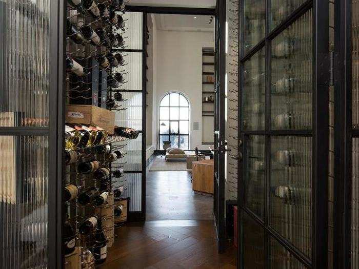 A wine room connects the kitchen and living room and can hold up to 630 bottles.