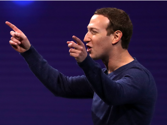 Instead of a gray t-shirt, Zuckerberg opted for a navy blue crewneck sweater — one could even call it Facebook blue.