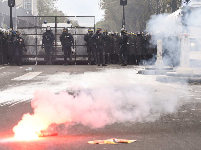 Riot police formed a barrier and fired tear gas at the protesters.