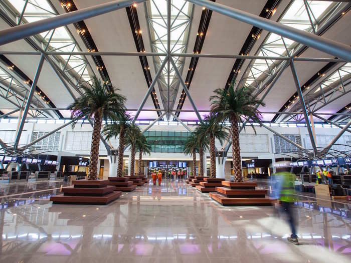 The airline began operating at the new passenger terminal at Muscat International Airport in March, and it looks pretty fancy, complete with giant indoor palm trees.