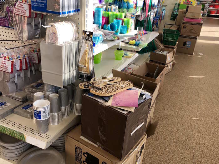 The boxes served as displays for misplaced merchandise and abandoned shopping baskets.