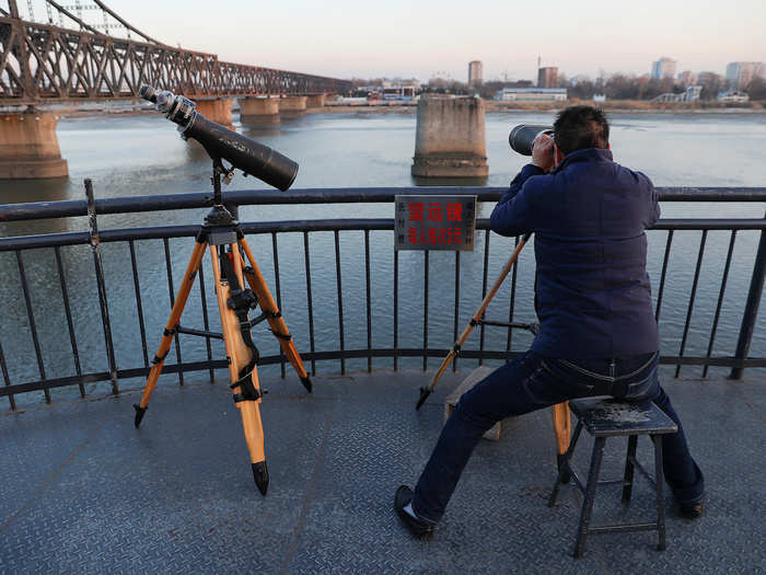 The Broken Bridge is a tourist attraction on the Chinese side, and visitors can use telescopes to see off the end.