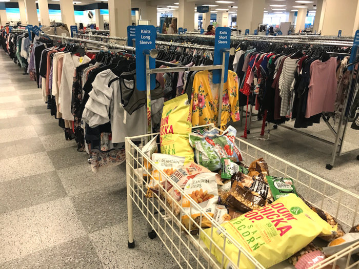 The store was strangely laid out. Snacks were seen in bins next to womenswear ...