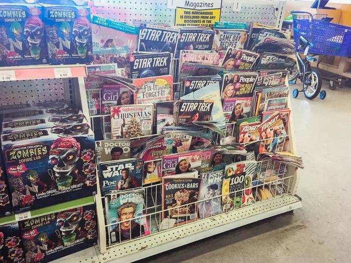 I spotted a messy shelf of old magazines near the registers.