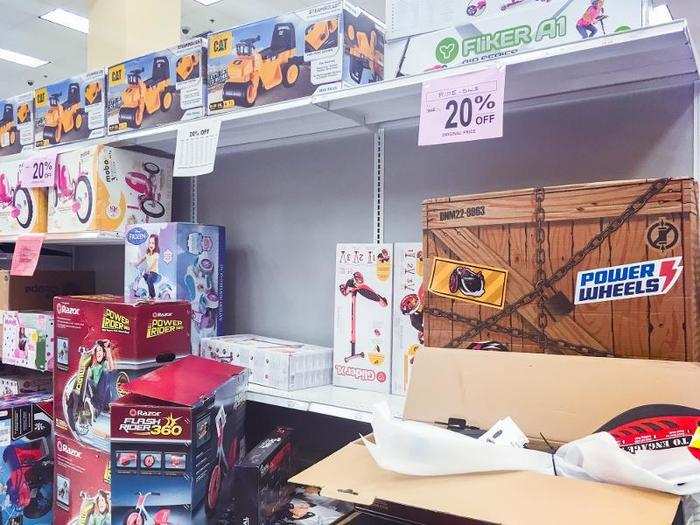 Some boxes were torn open with toys piled up on top. They were often left sitting in the middle of an aisle.