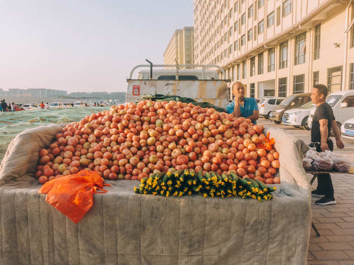 Farmers from nearby villages try to sell their fruit and vegetables to the workers as well.