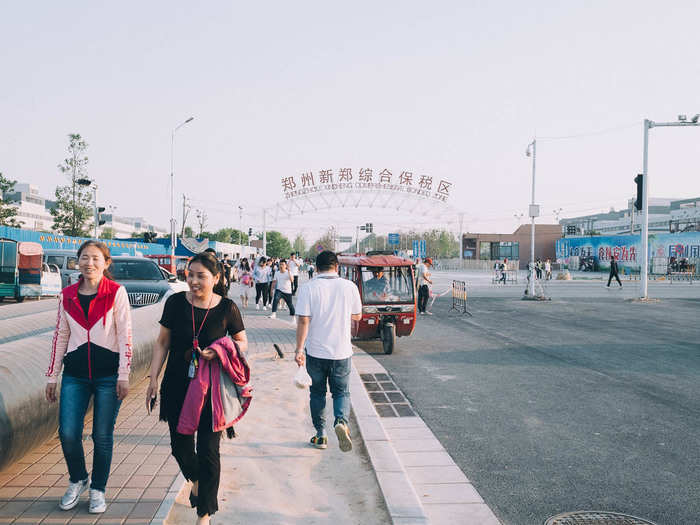 At 5 p.m., the day shift ends and workers stream out of the factory