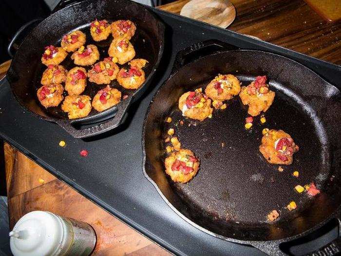 Once cooked, the fish was placed on top of an elote fritter, with extra kernals and strawberries.