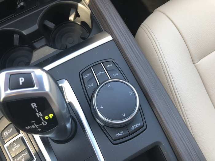 The knob-and-buttons to the right control the iDrive infotainment system.