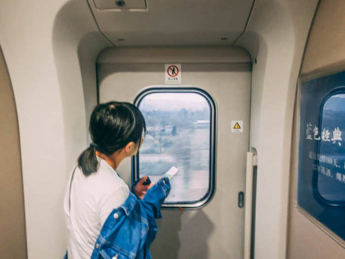 A lot of people seemed to enjoy killing the time by hanging out in the space between the carriages. People did this in the regular-speed train I took, except they used the space to chain-smoke cigarettes. This didn