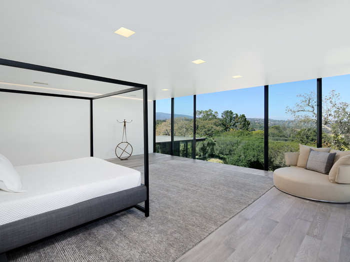 Adjacent is the master suite, which has wall of windows overlooking the massive backyard.