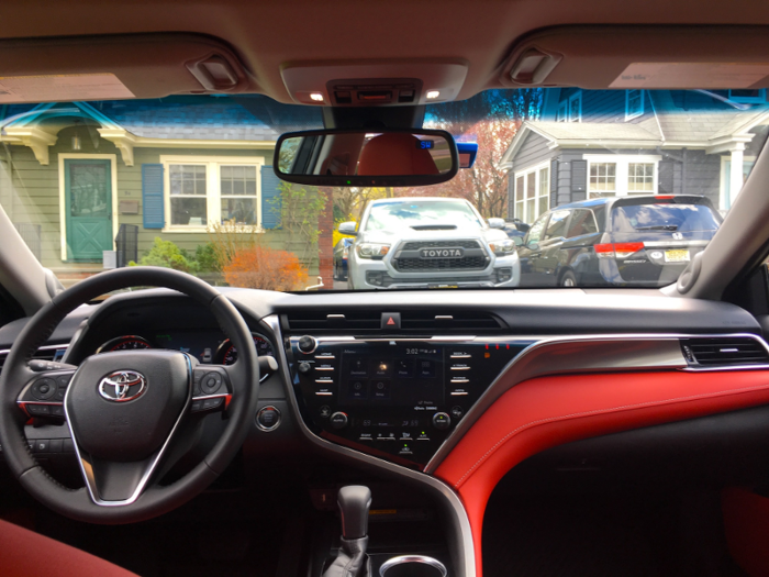 Inside, our test boasted a stunning blood red leather interior with black and metallic accents.