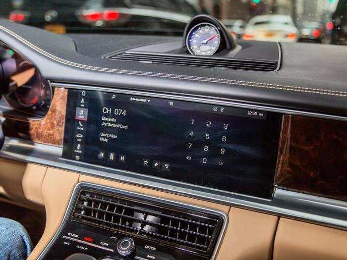 The center stack is dominated by a massive 12-inch touchscreen infotainment display.