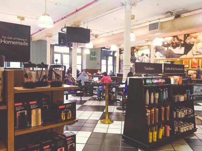 The third floor, home to the in-store Starbucks, was incredibly busy. The café area sold coffee mugs, tumblers, and other coffee-related products.