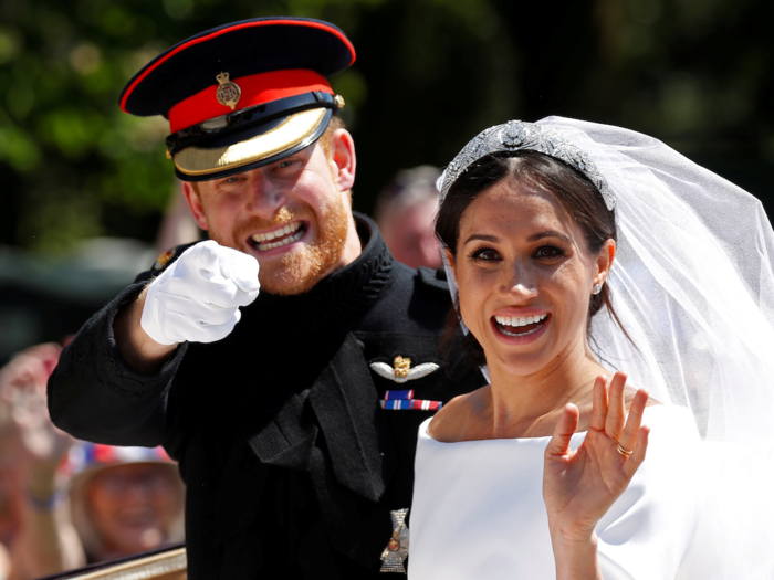 The couple looked totally elated as they left the chapel in a horse-drawn carriage.