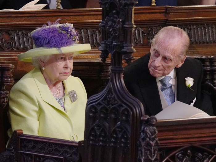 ...While the Queen and Prince Philip seemed a little more stern. The Queen, in line with protocol, was the last to arrive at the chapel before Meghan. She wore a lime green outfit.