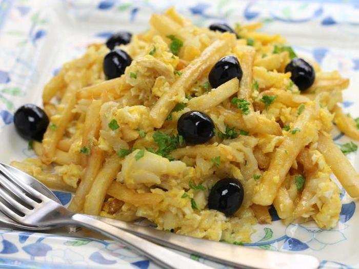 His absolute favourite dish is "Bacalhau à Brás," and is something he might have at dinner. Bacalhau is made from shreds of salted cod, onions, and matchstick-sized fried potatoes. It is served on a heap of scrambled eggs and garnished with things like olives and parsley.