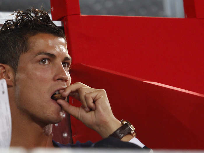 Regardless of how otherworldly his soccer skills are, Ronaldo is still human and does not live exclusively on healthy foods. Here he is tucking into a piece of chocolate.