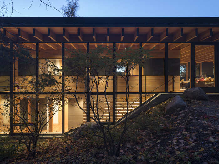 Stationed along a remote lake shore outside of Toronto, this two-story residence serves as a vacation home. Its architects call it the Bear Stand.