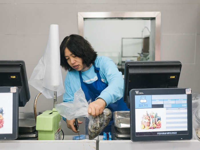 While most purchases happen through the app or through a cashier-less checkout counter, the seafood section still needs someone to weigh and price the products. But one scan of a QR code on Alipay and I was all set.