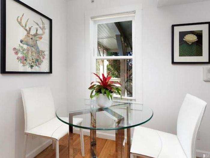 And a little eating nook is carved out to the side of the kitchen next to a window.